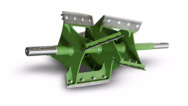 Utkastakselerator med skovler som samler og akselererer avlingsstrømmen mot midten.