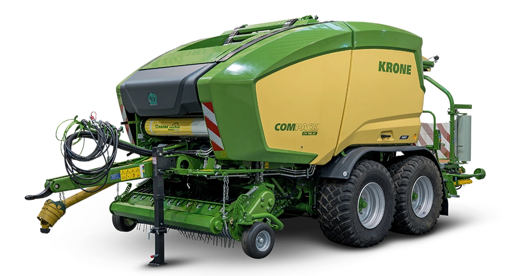 KRONE Compack Pro rundballpresse i grønn og gul farge med store hjul og integrert plastfolieutstyr.