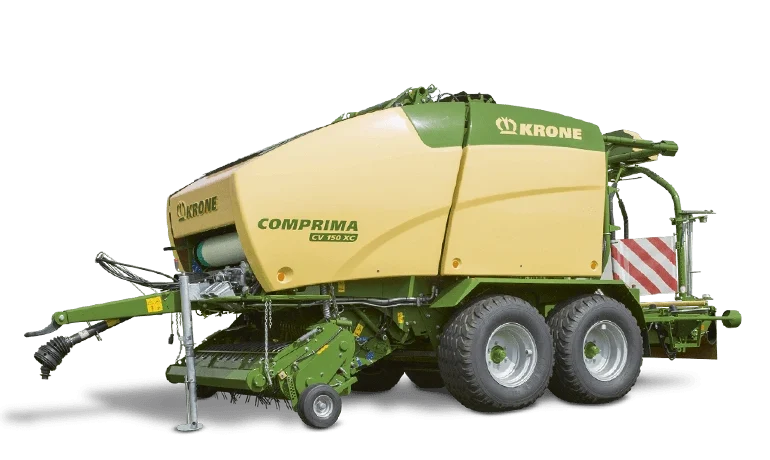 KRONE Comprima rundballpresse med gul og grønn farge, utstyrt med doble hjul og trekkstang for tilkobling til traktor.