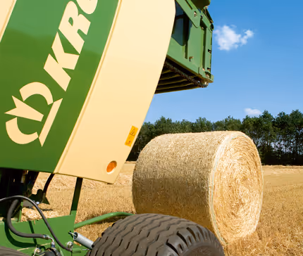 Nærbilde av Krone Fortima sin rulleenhet som viser metallrullene og mekanismen som former rundballene.
