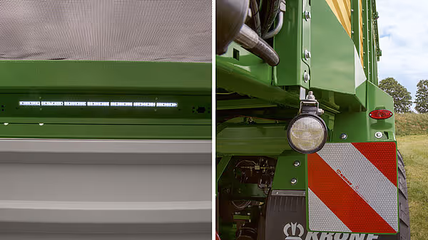 Detaljer av KRONE MX vogn med LED arbeidslampe, sikkerhetstilhengerkabel og reflekterende rødt-hvitt merke.