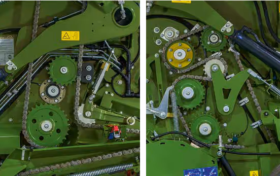 Detaljbilde av drivverk og tannhjul i KRONE Varipack rundballpresse, viser hydrauliske komponenter og kraftoverføring.