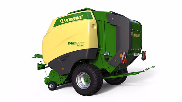 KRONE Varipack Plus rundballpresse sett bakfra, viser maskinens gule og grønne design samt bakre working-komponenter. Maskinen er utstyrt med store hjul og hydrauliske systemer.