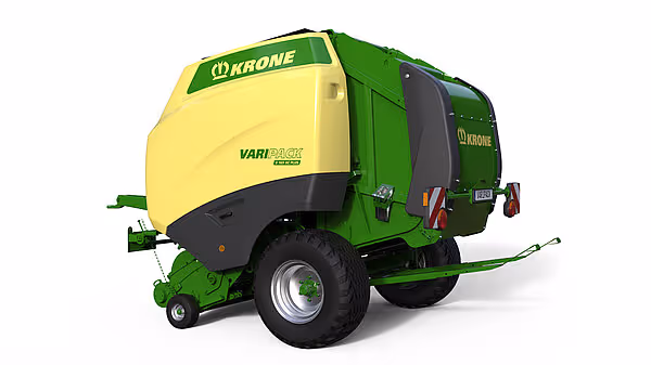 Krone Varipack Plus rundballer i grønn og gul farge, vist fra baksiden med hydraulisk tilkobling.
